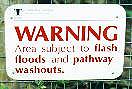 Warning sign: paths subject to flash floods